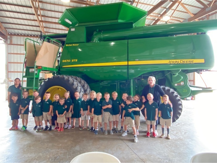 Mrs. Hunt’s class along side of the combine.